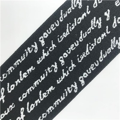 Резина декор. с надписью 50мм надписи белые фон черный (рул/37м)