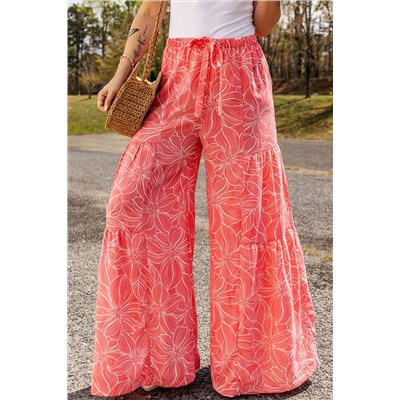 Розовые многоярусные брюки-клеш с флористическим принтом